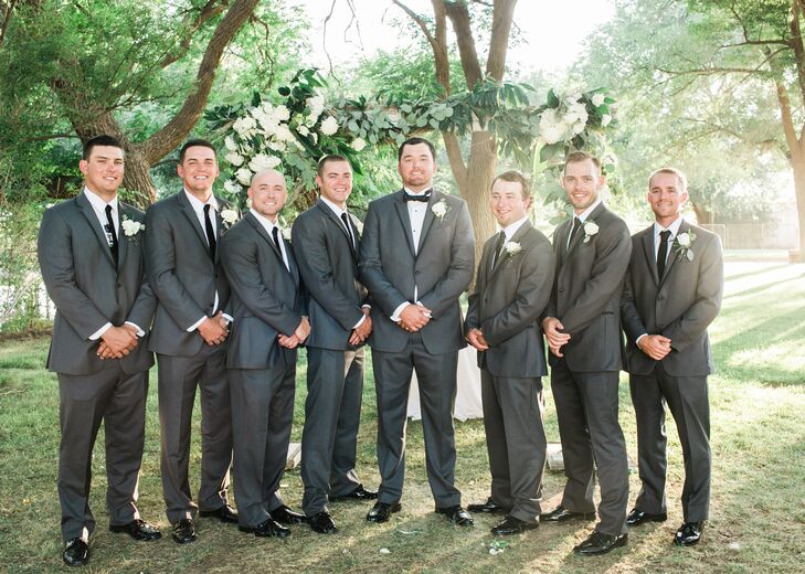 Derik and his groomsmen sported Vera Wang charcoal gray tuxedos. The groomsmen wore skinny ties, while Derik wore a bow tie. “Derik’s one request was that he wear a bow tie, and he looked so handsome,” Michelle says.