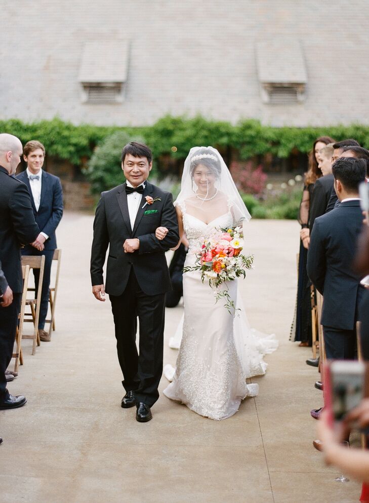 Taking cues from tradition, Alice was escorted down the aisle by her father. To establish a lighthearted feel for the ceremony, she skipped the classic bridal march in favor of “The Winner Is” from the "Little Miss Sunshine" soundtrack for her walk down the aisle.