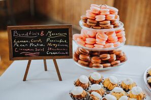 Colorful Macarons on Dessert Table with Chalkboard Sign