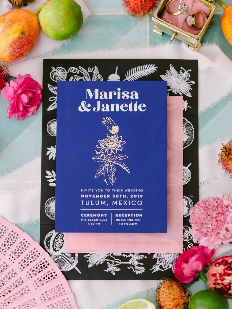 blue wedding invitation with illustrated passion flower