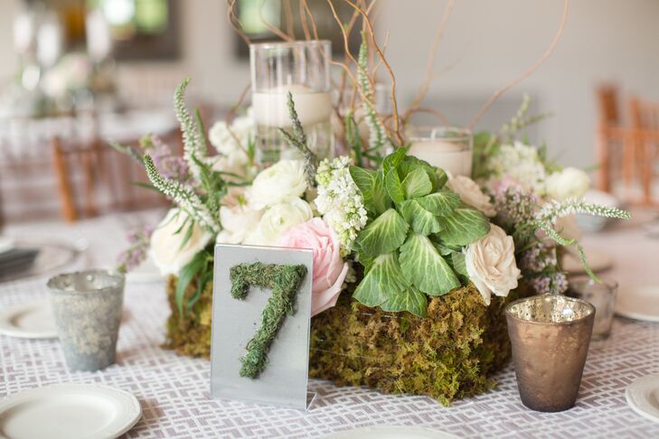 Irish-inspired details were woven throughout the day as a nod to Kathleen’s heritage. Moss was one of the major ways in which the couple incorporated the beauty of Emerald Isle into the decor, covering the centerpiece vases and table numbers in the soft, lush plant. The table linens also played into the theme, with the geometric pattern playing off a traditional Celtic motif.