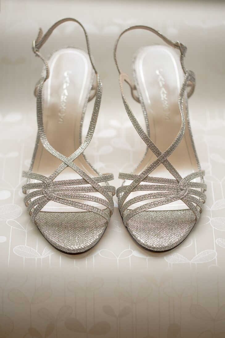 Heidi wore glitter silver strappy heels, adding a touch of glam to her bridal style.