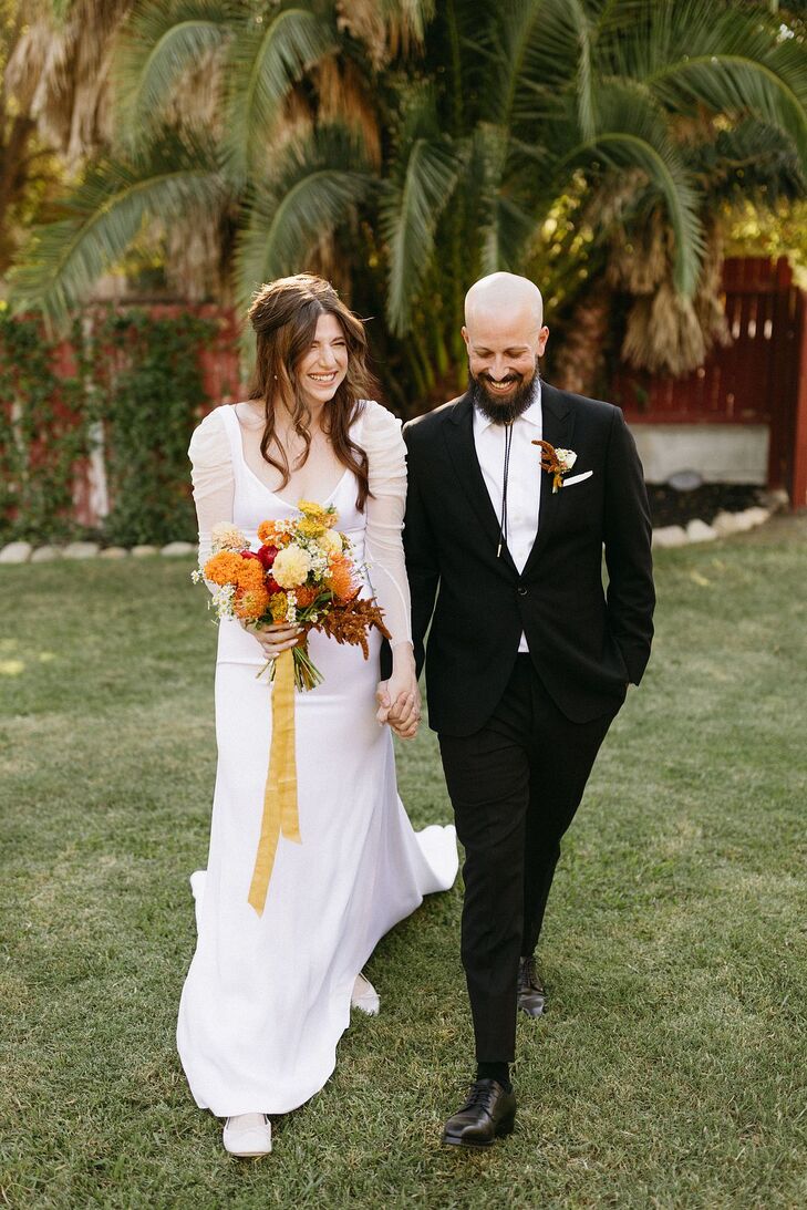 Bride in Modern Dress, Groom in Black With, Bolo Tie Hold Hands, Carry Bright Bouquet