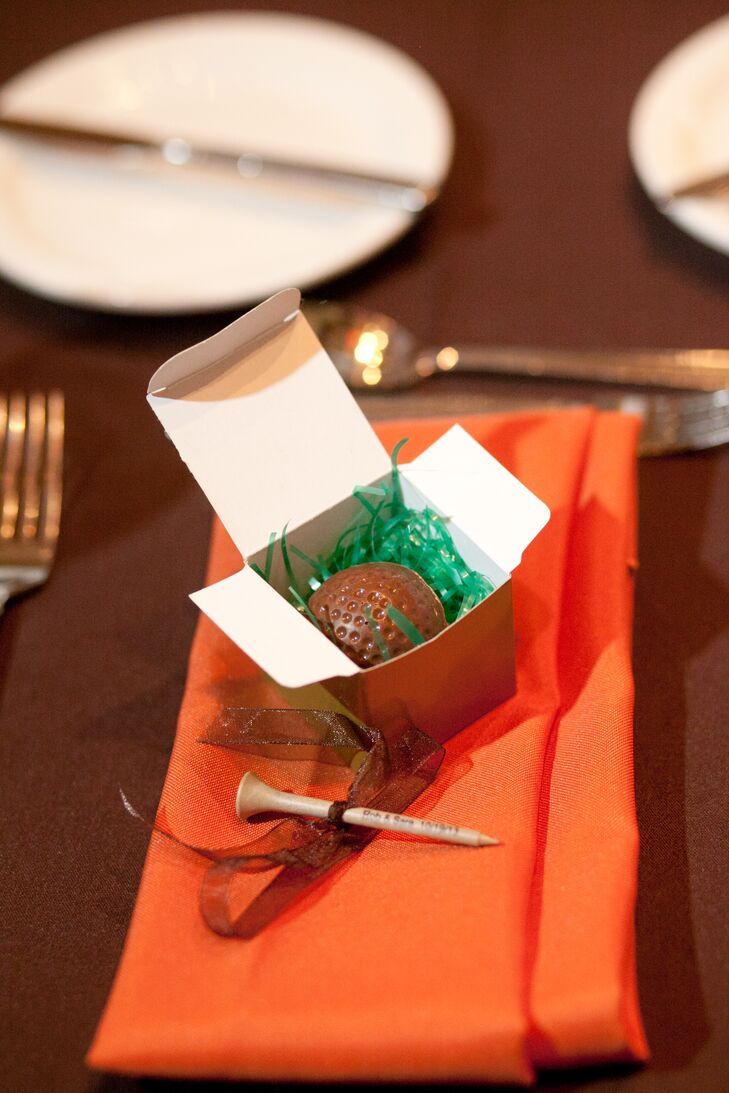 Chocolate golf ball favors referenced how Sara and Rob first met while mini golfing.
