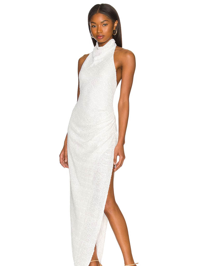 A model wears this gorgeous white high-necked slip dress.