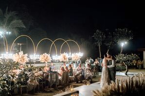 Couple Sharing First Dance Next to Long Dining Table, Floor Standing Chandelier Stands, Pampas Grass Decor Outdoors