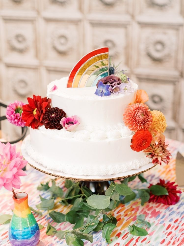 wedding cake with rainbow cake topper