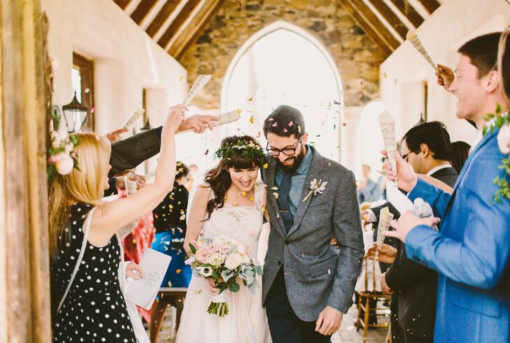 Kira and Chris exited their ceremony at a private chapel while wedding guests showered them with dried flower petals, provided by Chris's mother.