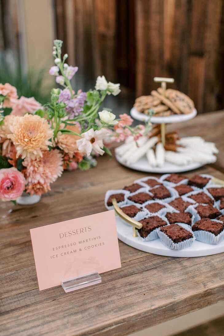 Dessert Table Featuring Cookies and Low Pastel Floral Centerpiece