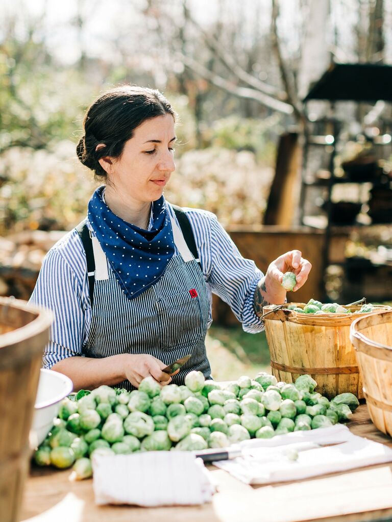 Caterer prepares a meal at a small wedding. 