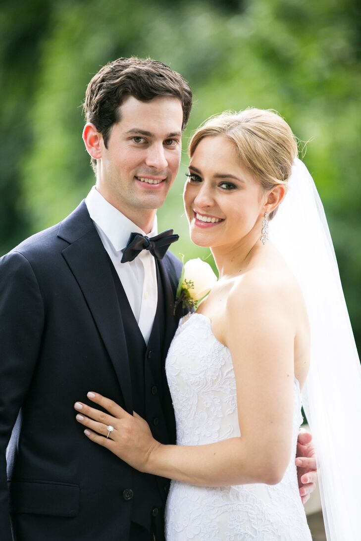 In search of a simple yet classic look, Emily found the perfect dress at Anna Maier Couture: an A-line, strapless style complete with an embroidered lace overlay. In keeping with the classic look, Robert wore a navy, custom-made suit by Tom James.