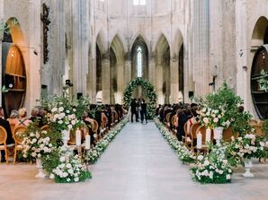 Luxurious Ceremony Aisle in Historic French Venue, White Flowers and Greenery, Verdant Arch