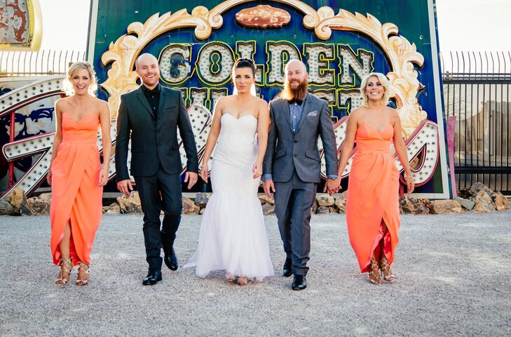 The bridesmaids wore bright coral dresses by Sheike that they could wear again, which paired seamlessly with the Neon Boneyard backdrop. The bride treated her bridesmaids to gold Kate Spade accessories. Dillon’s Best Man and twin brother wore a charcoal gray suit with a paisley shirt.