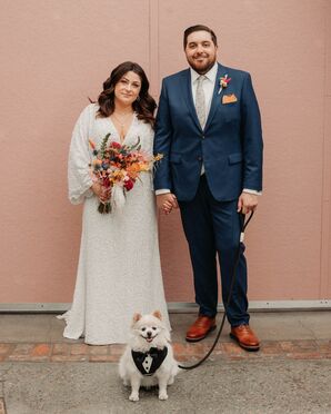 Bride in Long-Sleeve Sequin Gown, Groom in Navy Suit, Warm-Toned Bouquet and Dog