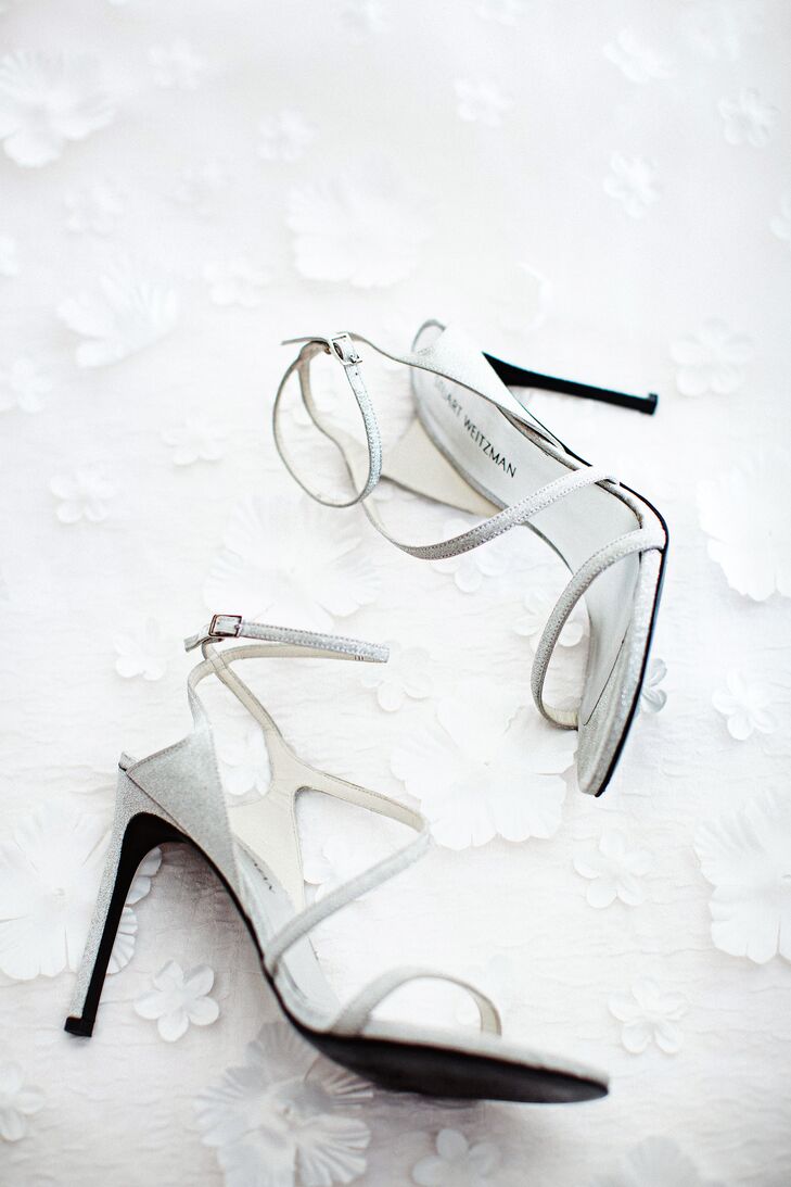 Rachel accessorized her Maggie Sottero gown with a BHLDN belt, star hair clips and matching star bracelet purchased in Vienna. She also wore a flower petal veil from Etsy and with Stuart Weitzman heels. “After months of searching for the right shoes, I finally found my Stuart Weitzman Nudist heels three weeks before the wedding (they are super-comfortable) and my Marabelle belt from BHLDN really added a touch of glamour to the whole look,” she says.