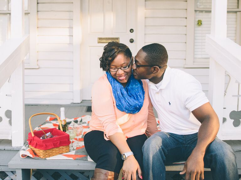 Engaged couple having a romantic picnic