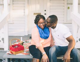 Engaged couple having a romantic picnic