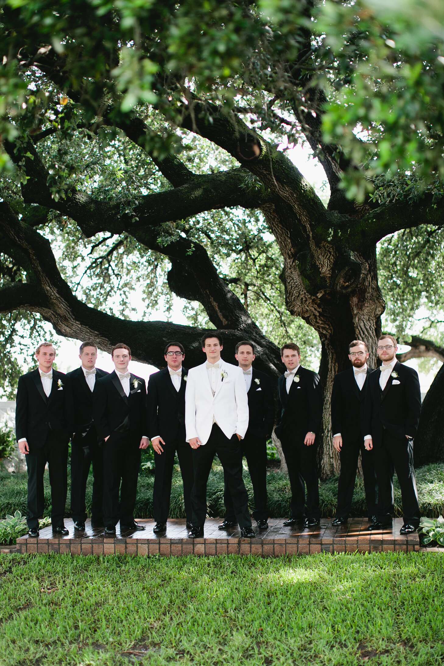 Classic Groomsmen Tuxes With Champagne-Colored Bow Ties