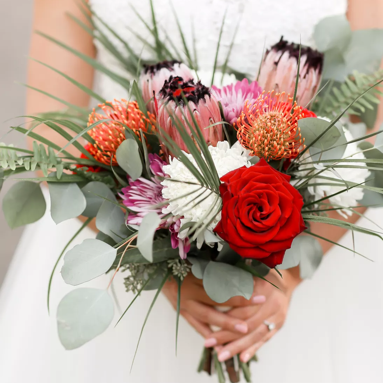 Red rose and pink protea wedding bouquet