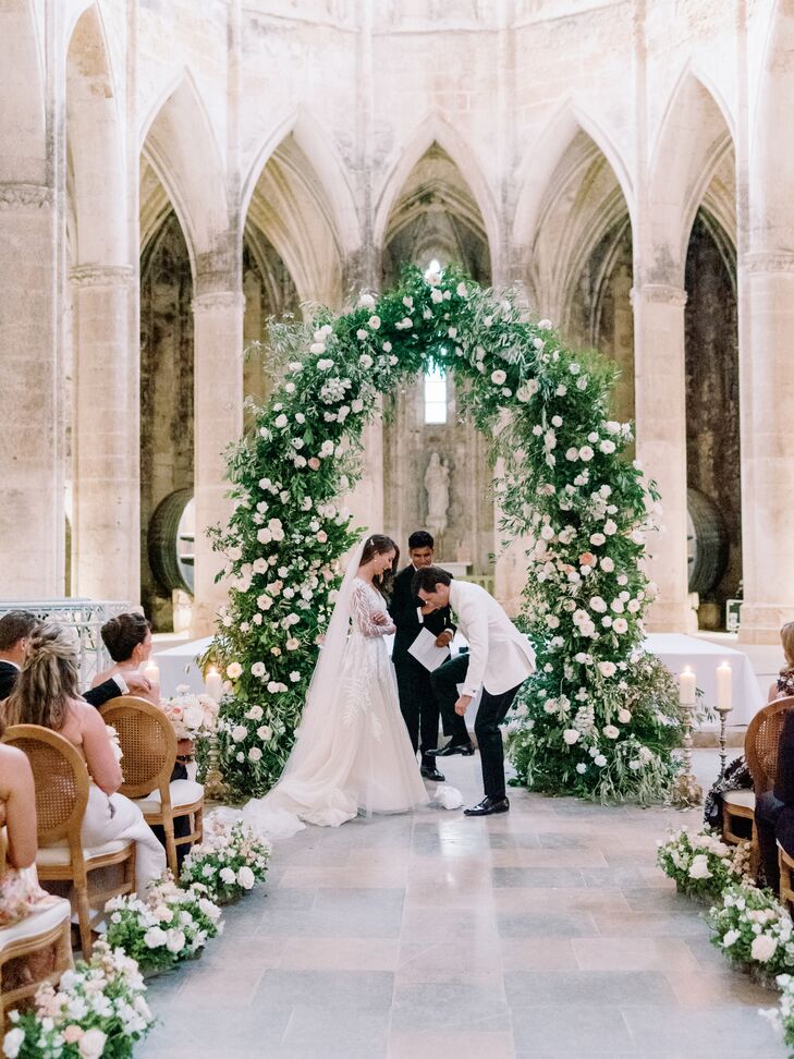 Bride With Long Veil, Groom in White Tuxedo Jacket Breaking the Glass at Historic French Venue Ceremony