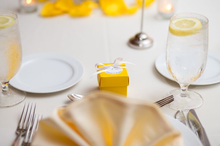 As wedding favors, Britni and James filled small yellow boxes with chocolate and tied them closed with white ribbon.