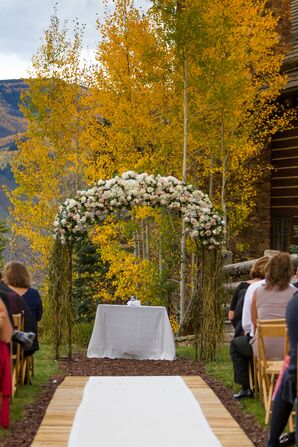 An Elegant White Floral Ceremony Arch