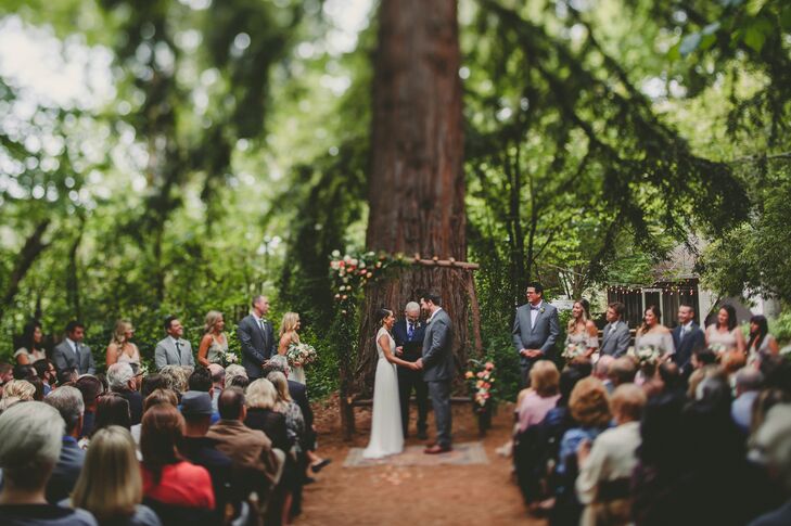 Crystal and Keith were married at the foot of a huge redwood tree under an arbor Keith and his family crafted from fallen branches and fresh flowers.