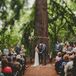 Crystal and Keith were married at the foot of a huge redwood tree under an arbor Keith and his family crafted from fallen branches and fresh flowers.