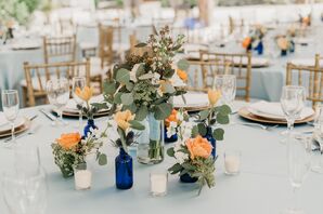 Vintage Bottle Centerpiece with Eucalyptus and Peonies