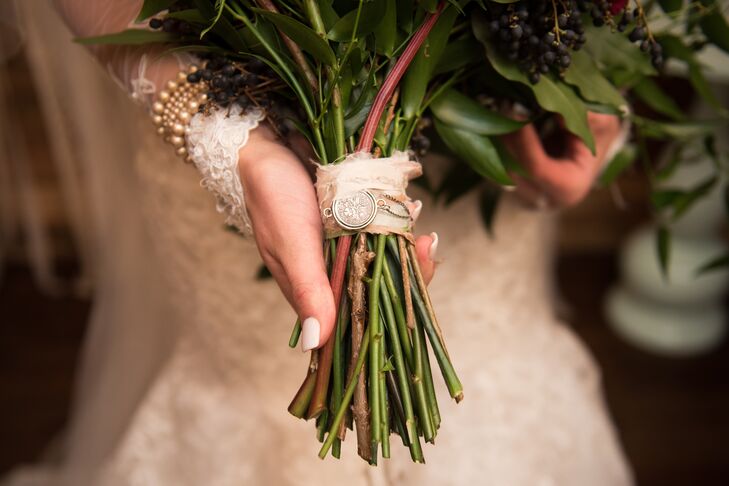 Brooklyn carried a bouquet of roses in burgundy, white and dusty rose. Wrapped around the stems was a gift from her aunt; an antique English sixpence. Such coins were commonly carried by brides in the early 1900s and added an elegant touch to the bouquet.