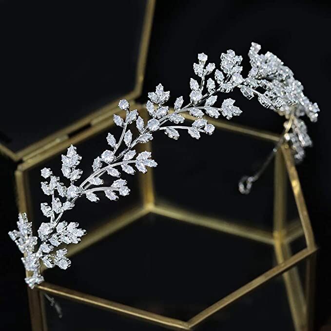 Headband with gems inlaid across a silver band in a leaf design