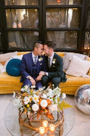 Couple Sitting on Yellow Velvet Couch