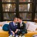 Couple Sitting on Yellow Velvet Couch