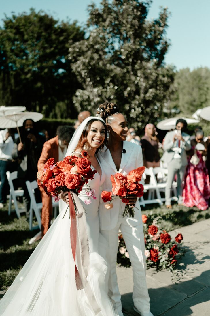 “The theme of our wedding was a garden oasis,” says Dom (right), a firefighter/EMT. “Flowers have been our love language from the beginning of our relationship.”