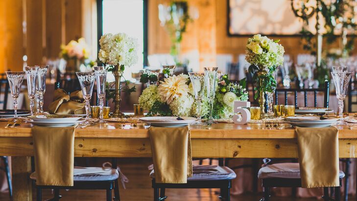 Gold and Black Barn Reception with Green and White Floral Arrangements