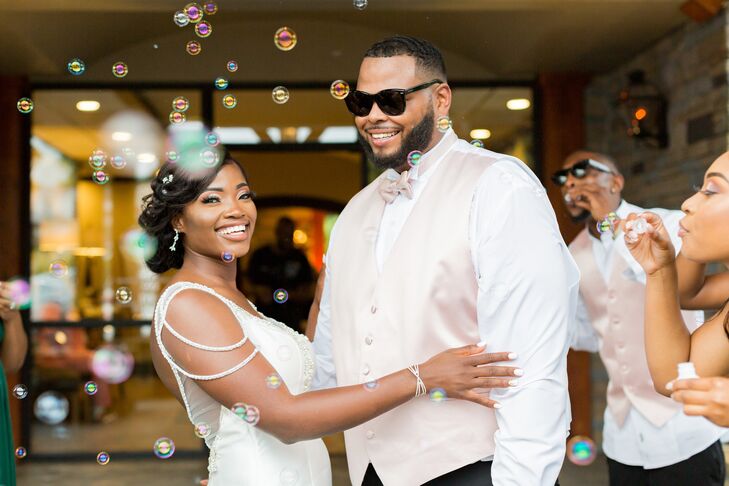 Couple Embraces During Bubble Grand Exit at Stone River in Columbia, South Carolina