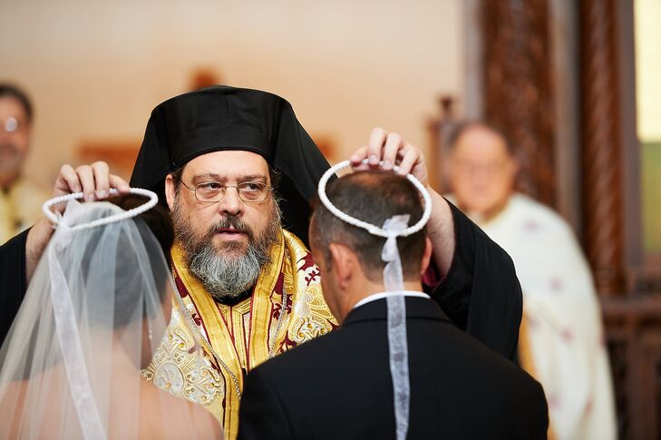 During the ceremony, Maria and Chris had a traditional Greek Orthodox stefana ceremony. The two crowns, tied together with white tulle ribbon, where exchanged back and forth three times to symbolize the couple's union.