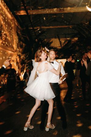 Bride in Short Dress, Should Bows Dancing With Groom in Dark, Disco-Ball-Lit Reception