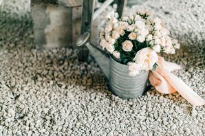 Rustic Watering Can Filled with Light Pink Roses and Peonies
