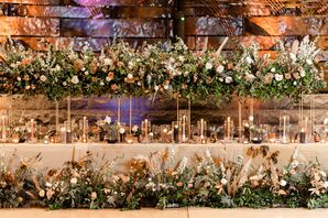 Head Table With Tall Centerpiece and Ground Flower Arrangements