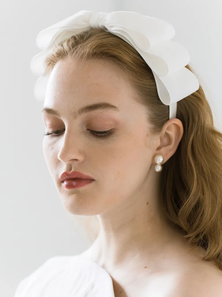 White bridal headband with oversized velvet bow