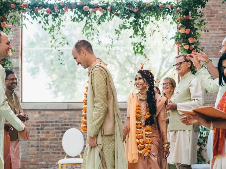 couple taking seven steps around holy fire during Hindu wedding ceremony