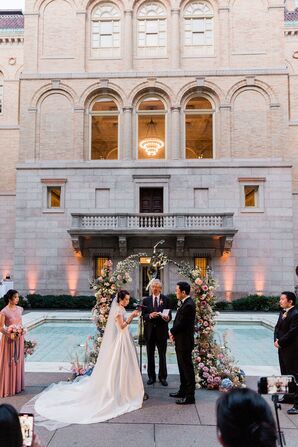 Wedding Ceremony With Lush Wedding Arch