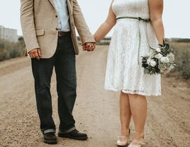 Bride and groom holding hands