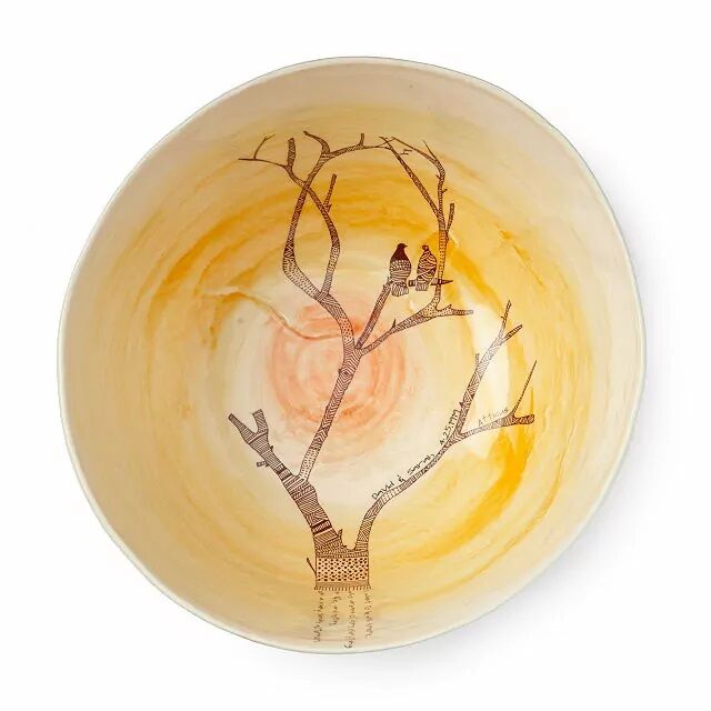 Ceramic bowl featuring a romantic bird print. 