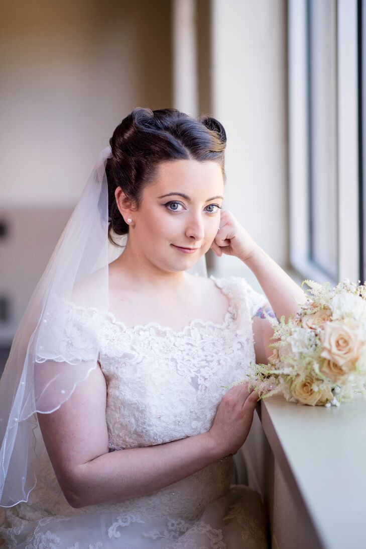 Leah wore her hair in tight victory rolls to complement her vintage-inspired lace wedding dress and retro-themed celebration. The entire look was inspired by looking at her grandparents's old wedding photos.