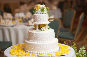 White Wedding Cake With Yellow Rose Petals