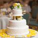 White Wedding Cake With Yellow Rose Petals
