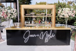 Black-and-Gold Custom Bar With Neon Sign
