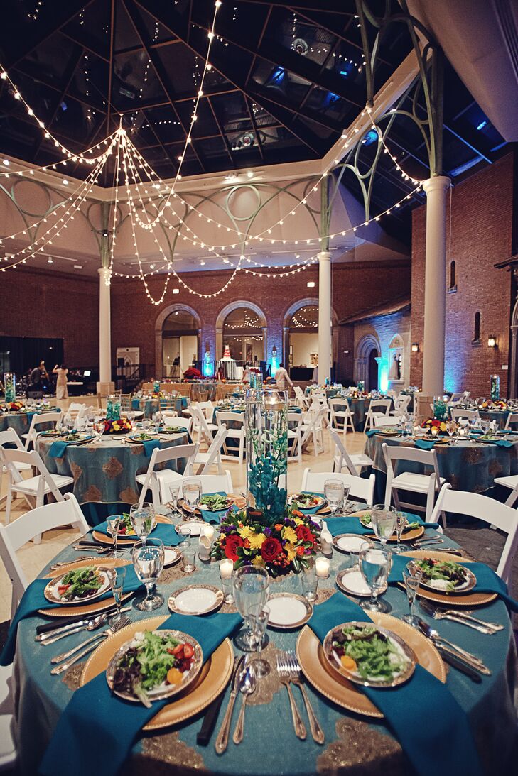 “Our wedding style was an Old Spanish inspired theme, and we incorporated the theme into the flowers, table setting and menu,” says Ariel. “We wanted it to be colorful yet classy at the same time. Our main colors were teal and gold with accents of reds, purples, and oranges.”